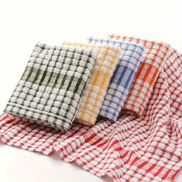 A stack of colorful absorbent cotton cleaning cloths featuring plaid patterns in green, yellow, blue, and red.