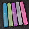 A row of six translucent silicone toothbrush cases in various colors including blue, green, purple, white, and pink.