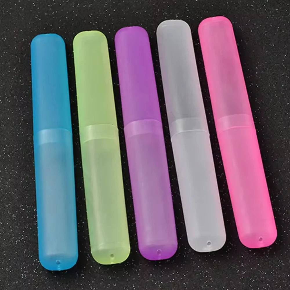 A row of six translucent silicone toothbrush cases in various colors including blue, green, purple, white, and pink.