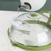 A clear microwave splatter cover with a water steamer is shown being used to pour liquid into a dish.