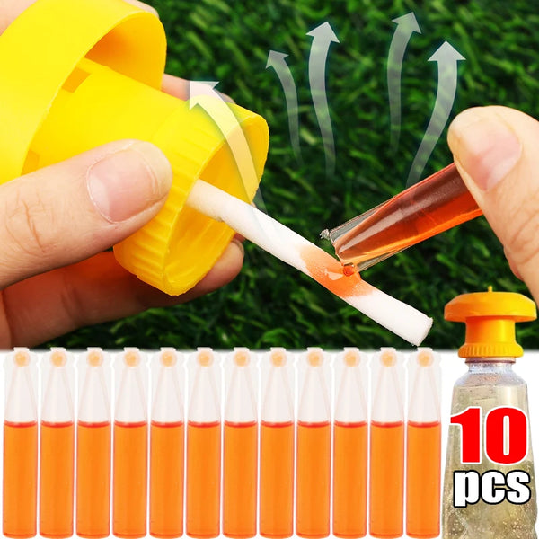 A hand is using a yellow tool to apply an orange substance onto a white applicator for fruit fly and pest trap use.