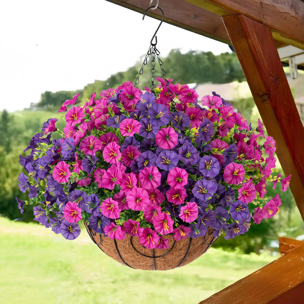 A hanging basket overflowing with artificial morning glory flowers in shades of purple and pink.