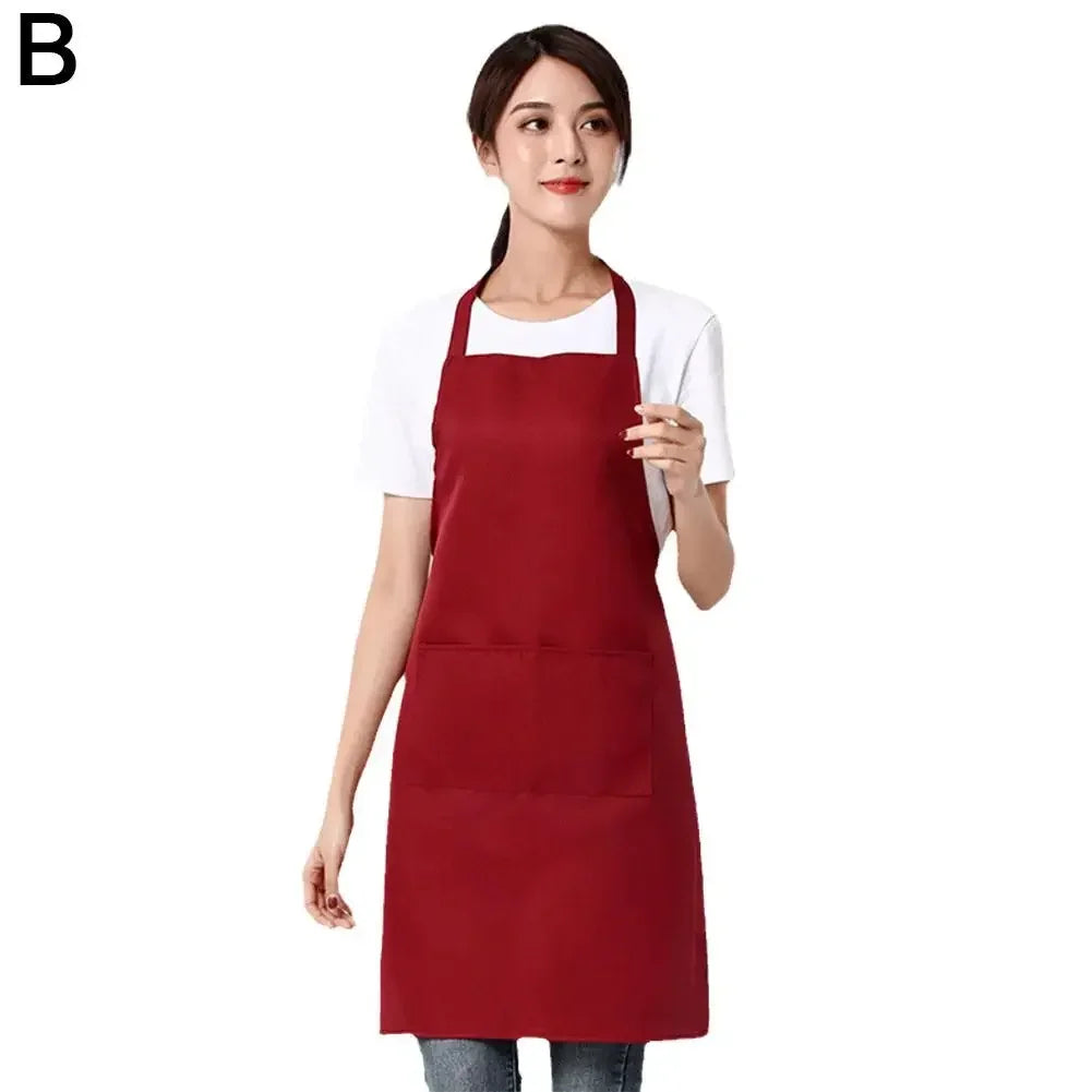 A woman wearing a maroon waterproof apron over a white shirt.