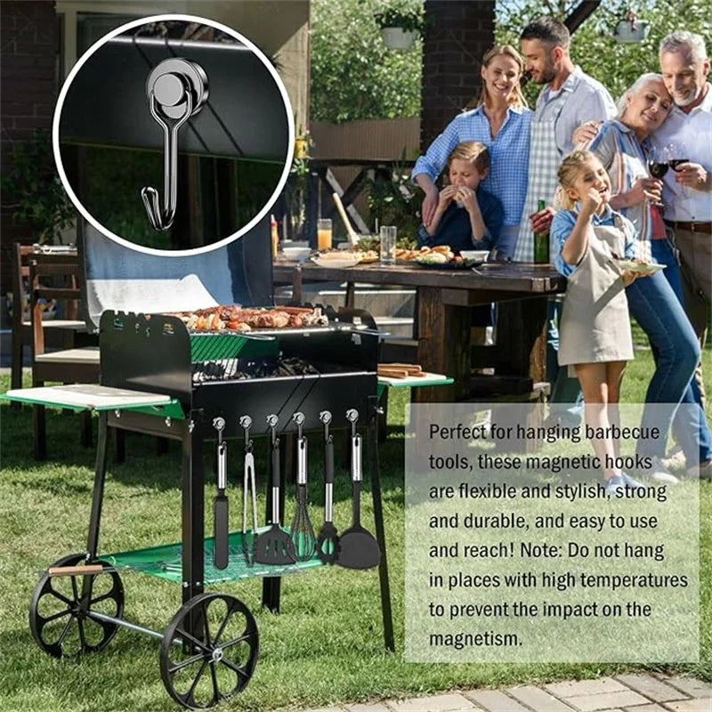 A black rolling magnetic hook rack with various cooking tools is shown outdoors on a lawn.