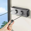 A hand is pulling a black cord from an adjustable stainless steel drying rope lock mechanism mounted on a wall.