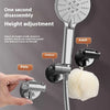A silver shower head holder with a suction cup and height adjustment mechanism is shown next to a hand and a white sponge.