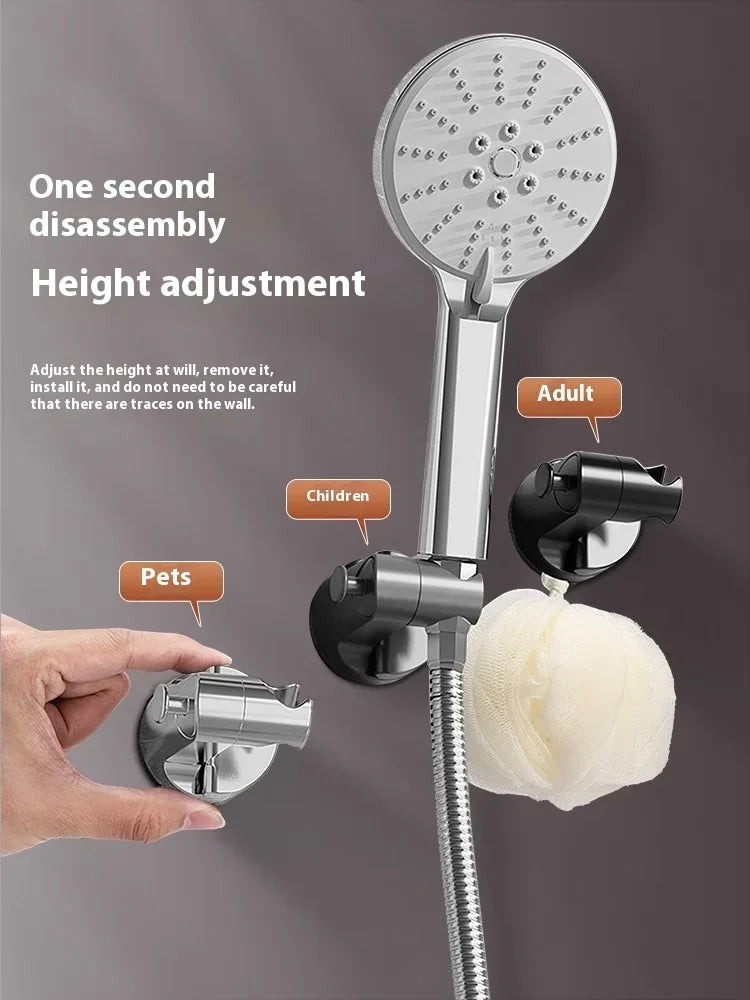A silver shower head holder with a suction cup and height adjustment mechanism is shown next to a hand and a white sponge.