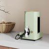 A light green reusable cable management organizer with a black cord is shown on a white surface.