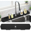 Schwarzer Silikon-Spritschutz und Abflussmatte mit Wasserhahn und Seifefläskchen