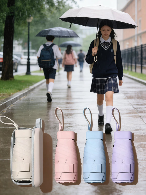 A set of five compact 5-fold travel umbrellas in various pastel colors displayed on a light surface.