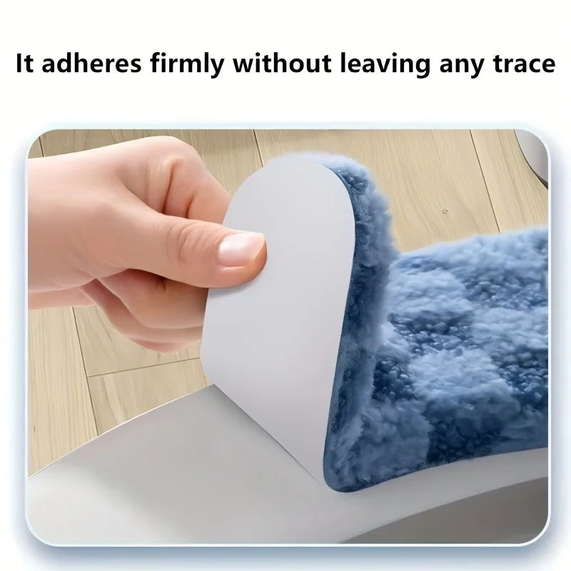 A hand firmly adheres a white cushion cover to a blue, fluffy toilet seat.
