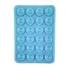 A silicone suction cup phone stand with multiple holes for hands-free viewing.
