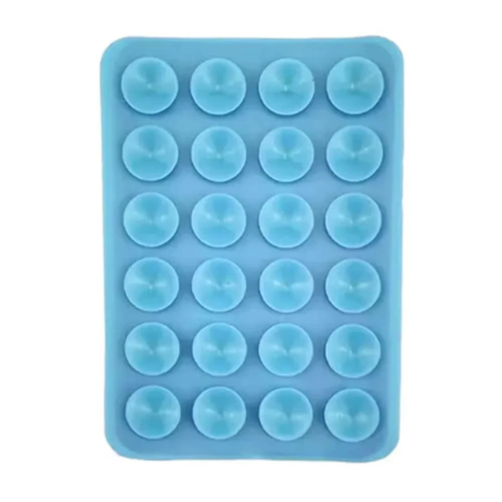 A silicone suction cup phone stand with multiple holes for hands-free viewing.