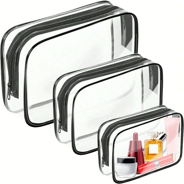 A set of clear plastic cosmetic organizer bags with zippers shown in various sizes.