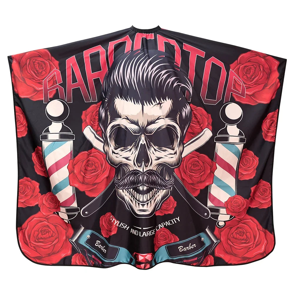 A black fabric cape featuring a graphic design of a skull surrounded by red roses and the text BARBERTOP.