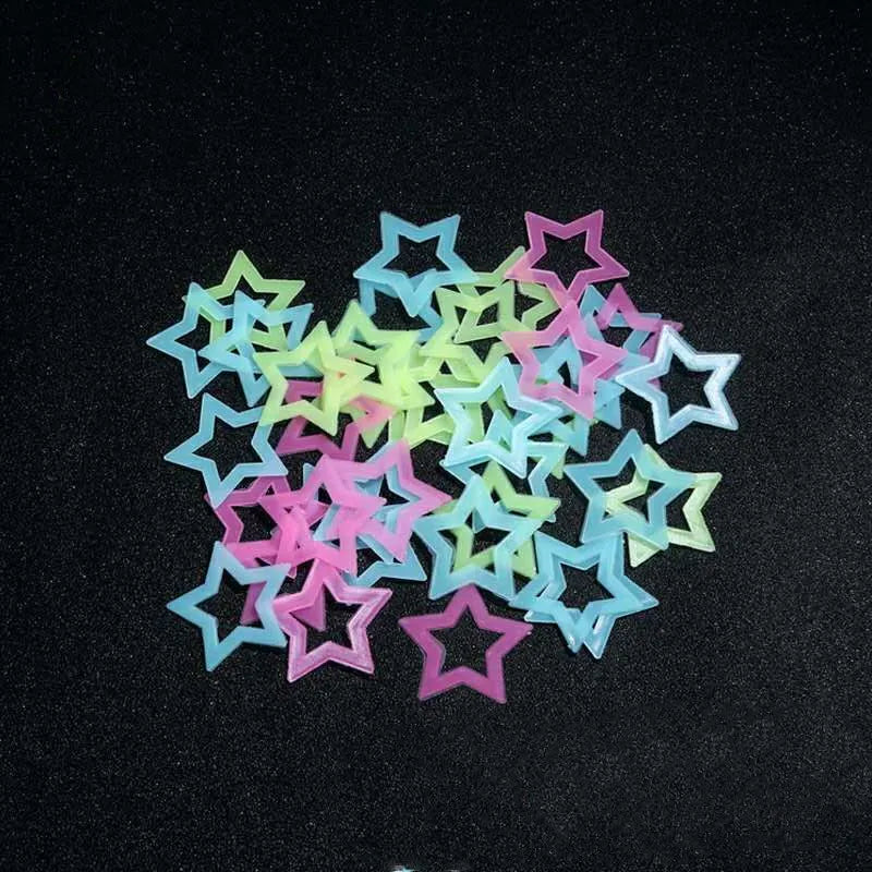 A collection of glow in the dark 3D star wall decals in various pastel colors like pink, blue, and green.