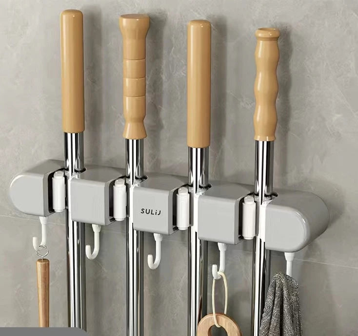 Wall mounted broom holders with wooden handles and chrome shafts for kitchen or bathroom