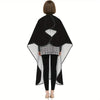 A black professional salon hair cutting cape with a gray patterned apron and adjustable neck closure.