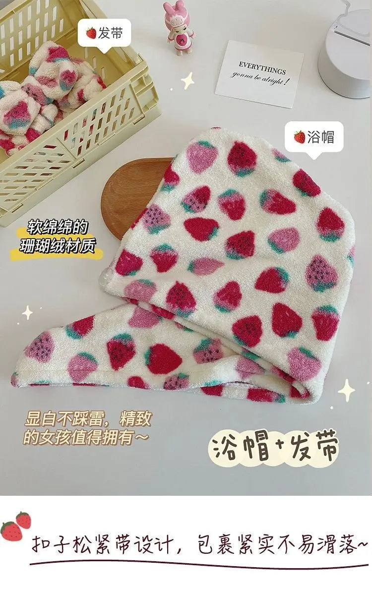 A pink and white strawberry print quick-drying hair towel headscarf is shown folded next to a wooden tray.