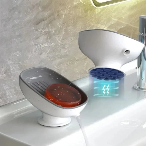 A white heavy duty suction cup soap dish with a drainer and an LED light is shown on a countertop.