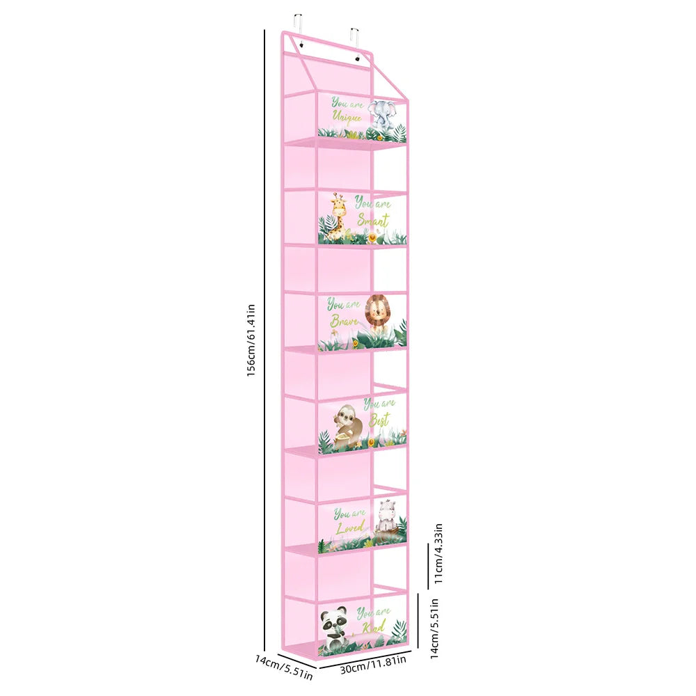 A tall pink over-the-door fabric storage organizer with multiple pockets featuring small plants and decorative elements.