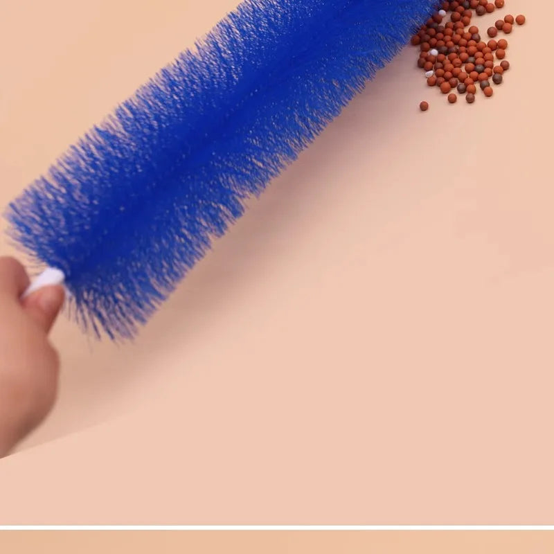 A blue ceiling fan cleaning brush with bristles is shown next to loose cleaning bristles on a light background.