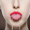 A close-up of a woman's mouth showing bright red lips and tongue being scraped with a stainless steel tongue scraper.