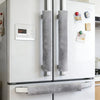 A white refrigerator with two gray oil-proof handle covers installed on the doors.