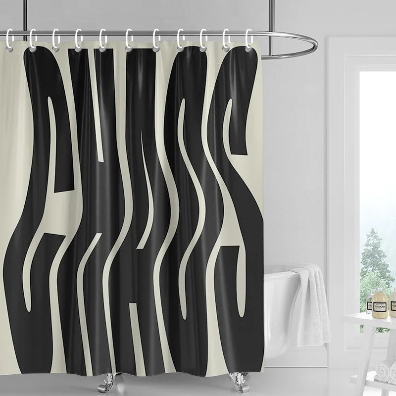 Black and white abstract geometric art shower curtain hanging on a rod