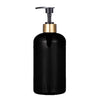 A black refillable pump soap dispenser bottle with a gold-colored pump top.