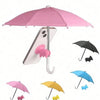 A pink umbrella is shown above a smartphone, with various colored umbrellas and small animal toys below.