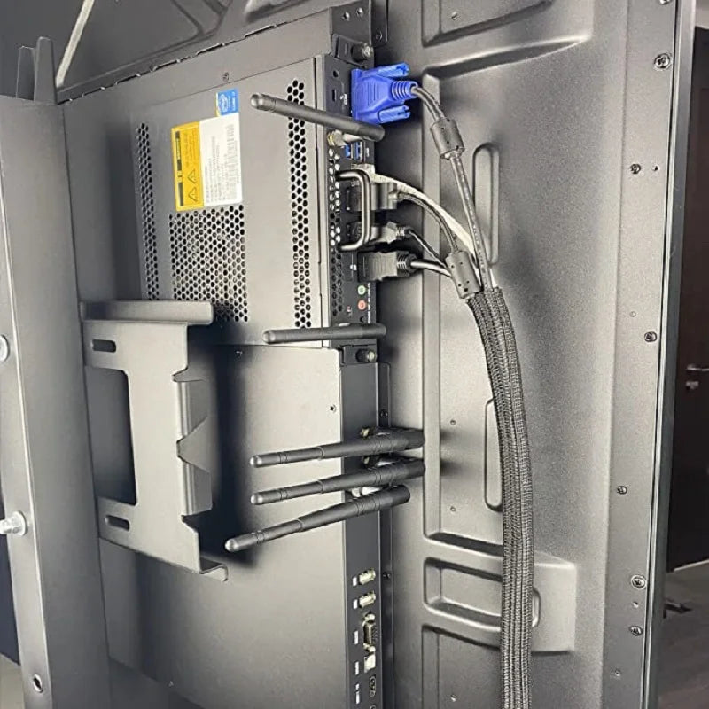 A close-up view of a computer component showing braided cable sleeves and connectors inside the chassis.