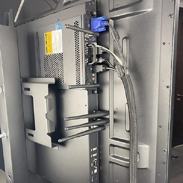 A close-up view of a computer component showing braided cable sleeves and connectors inside the chassis.