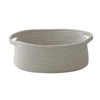A light gray handwoven rope storage basket with handles.