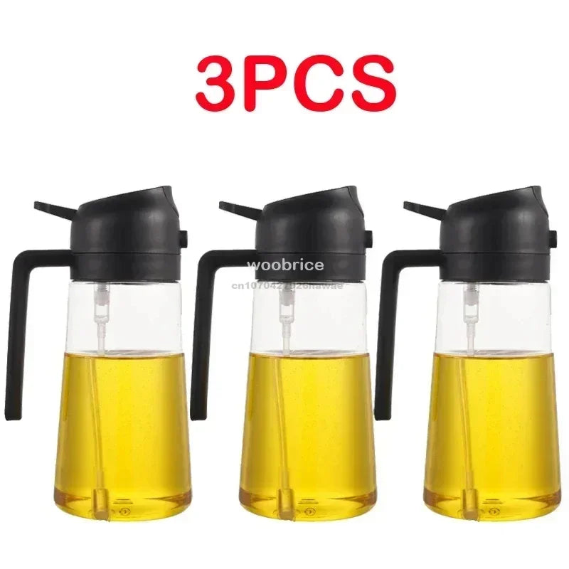 Three clear glass oil spray bottles with black pumps and yellow oil inside