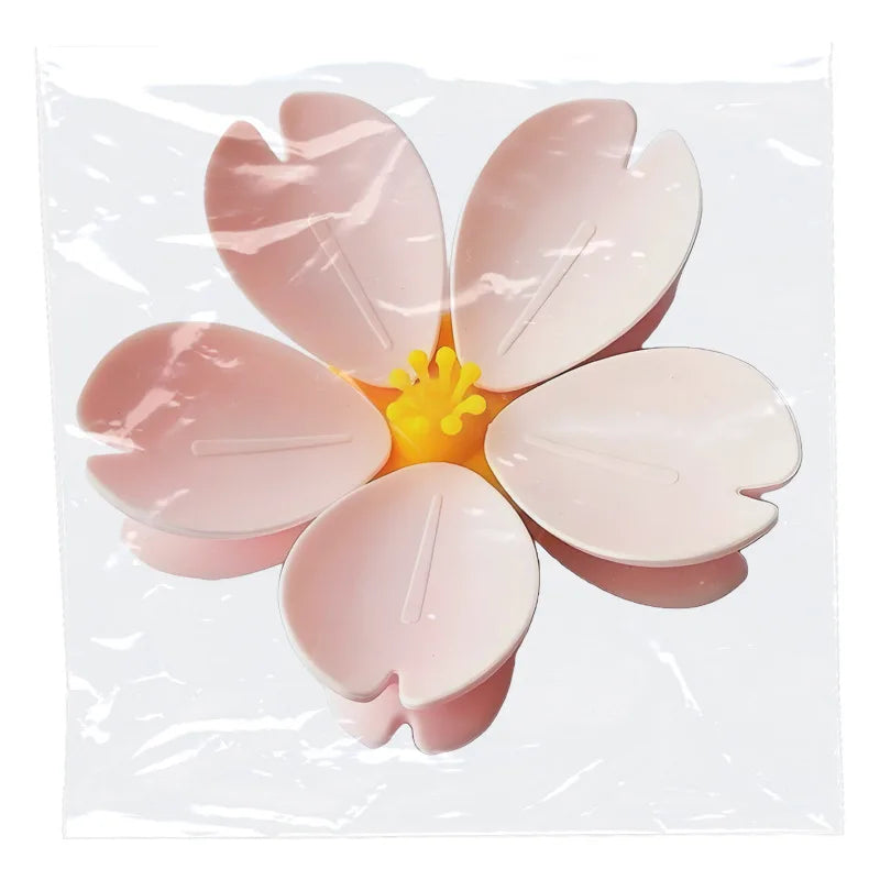Five pink magnetic fridge seal clips shaped like leaves are displayed on a clear background.