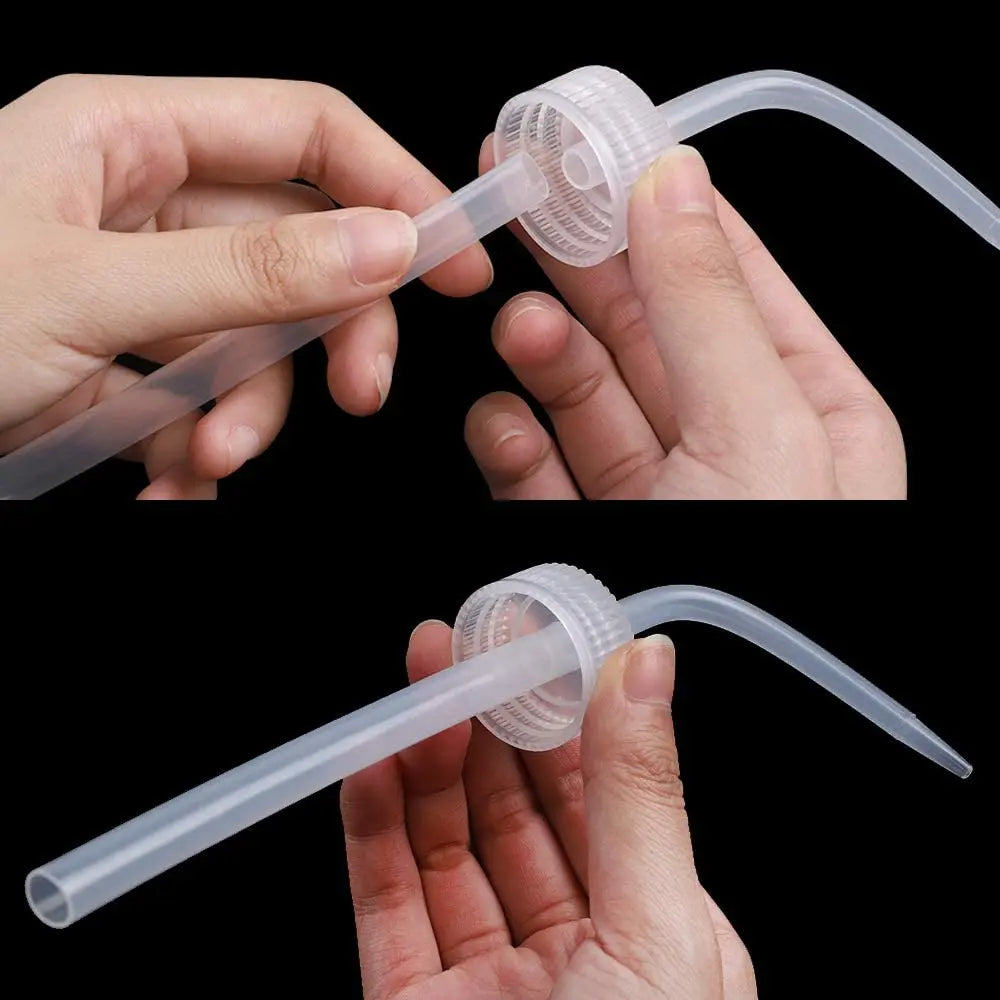 Two clear plastic squeeze bottles with measurement marks being held by a hand
