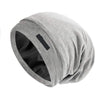 A gray adjustable silk-lined night cap rolled up, showing the interior lining.