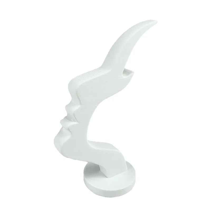 A white minimalist 3D printed profile eyeglass stand with a curved, stylized design.