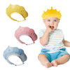 Three colorful adjustable baby bath shampoo shield caps in yellow pink and blue shown next to a baby