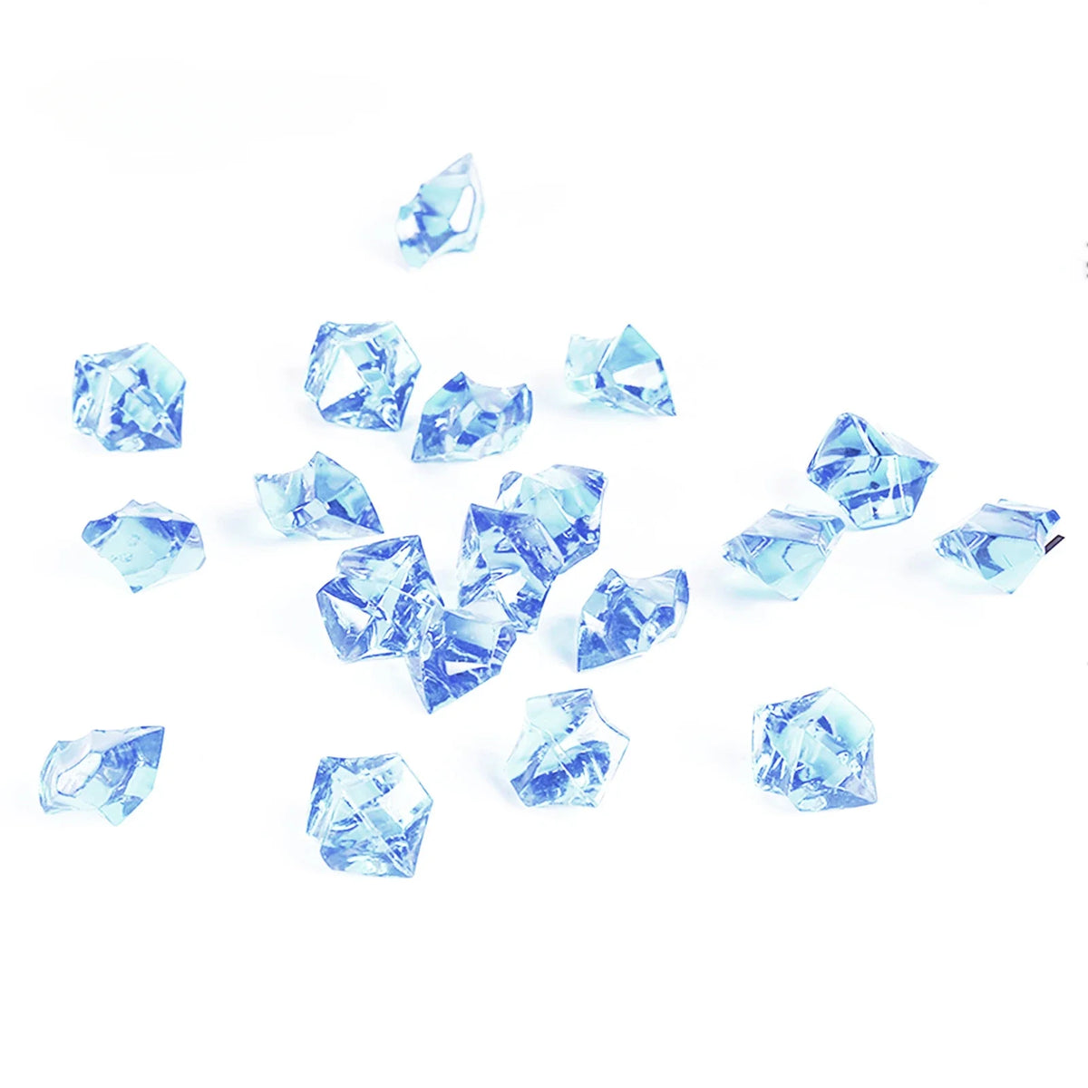A scattering of crushed, translucent blue crystal ice stones on a white background.