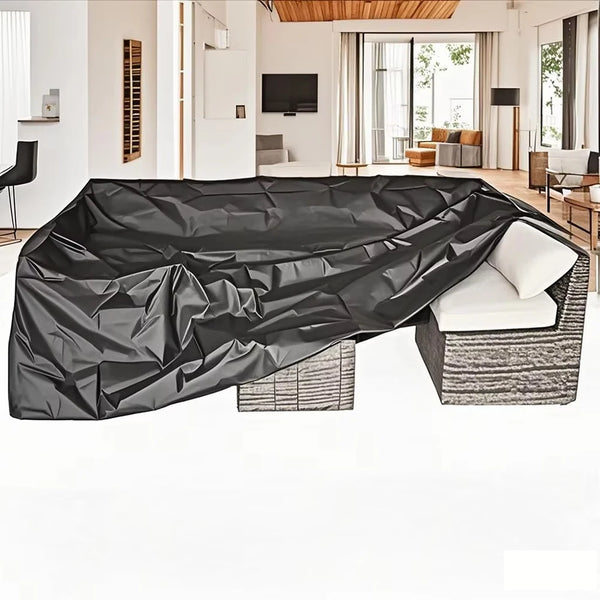 Black heavy-duty waterproof outdoor furniture cover draped over a modern outdoor sofa.