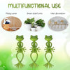 Three green frog-shaped plant supports or vine holders for indoor plants
