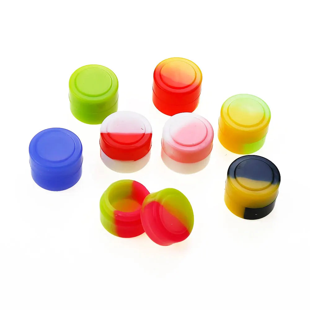 A collection of colorful, round silicone storage jars in shades of green, orange, red, yellow, and blue.