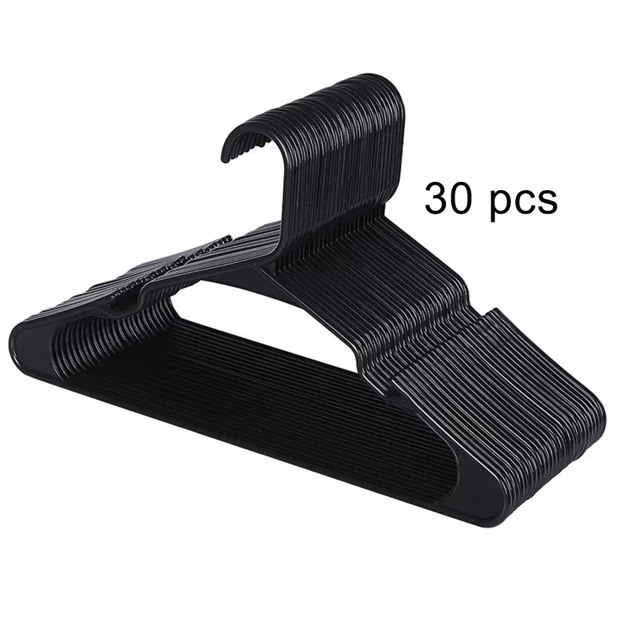 A set of thirty black plastic clothes hangers with a curved hook design.