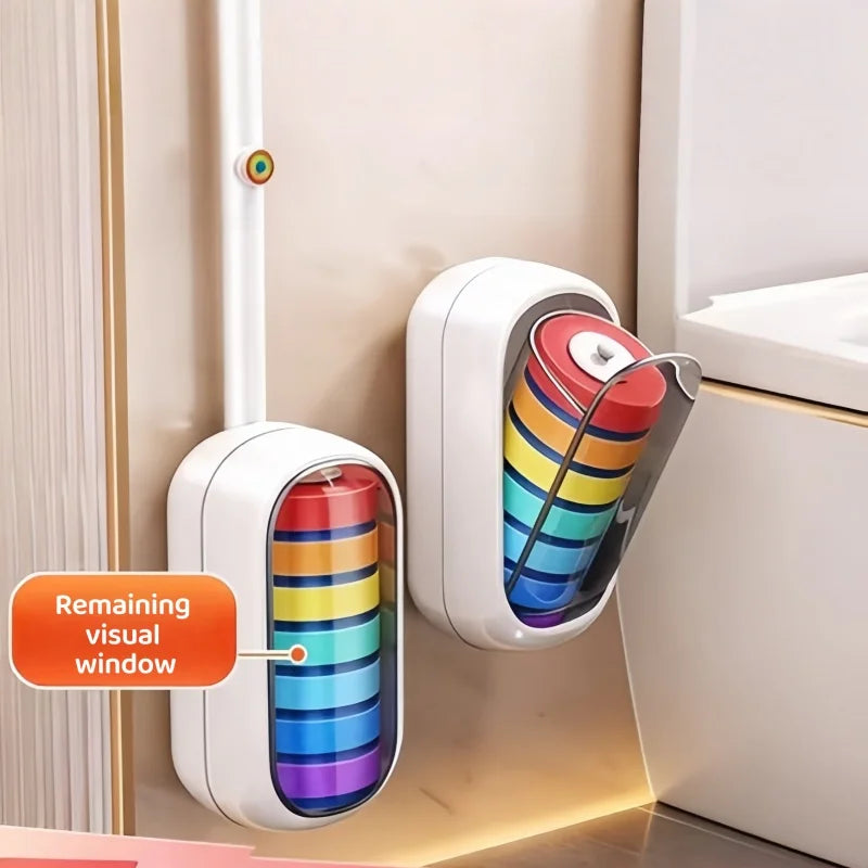 Support pour brosse de toilette mural avec des brosses colorées, à côté d'une armoire de salle de bain blanche.