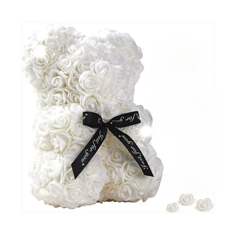 White rose teddy bear wrapped with a black ribbon for special occasions