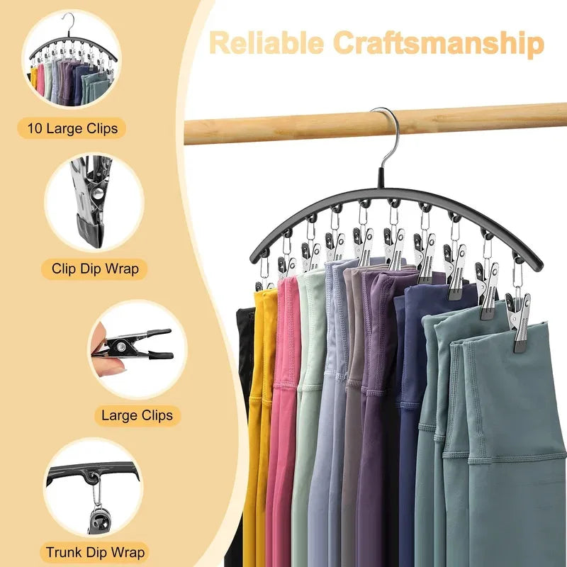 Curved metal hangers with 10 clips used to organize clothing on a wooden rod.