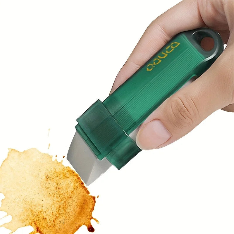 A hand holds a green reusable household stain remover eraser, applying it to a stained surface.