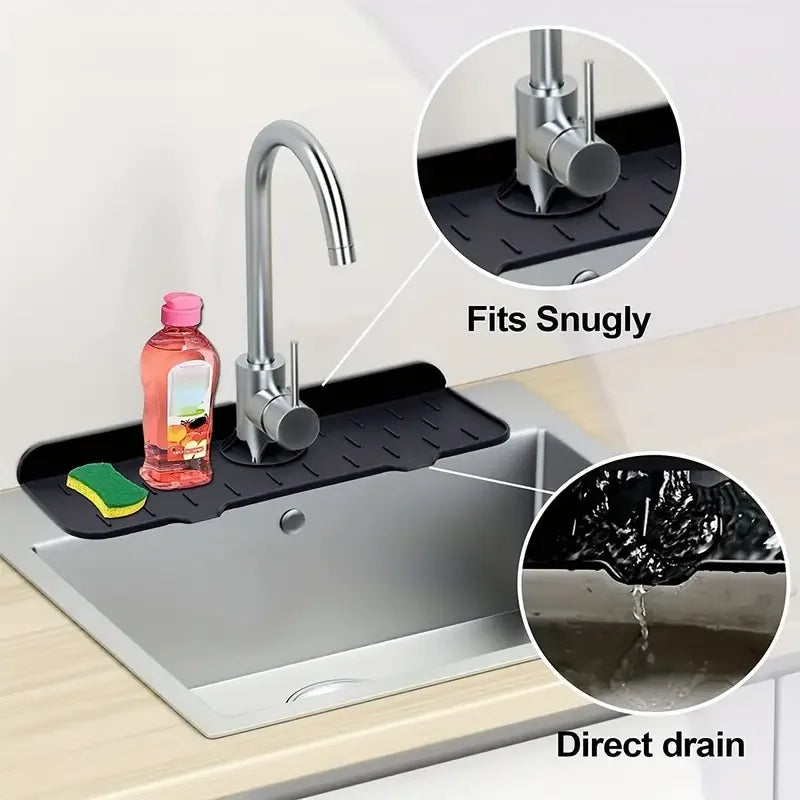 Silicone faucet splash guard mat fitting snugly on a kitchen sink with a direct drain feature.